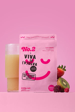 400g pouch of Viva La Vulva No2 collab Kiwi Berry with a glass of mixed psyllium and fruits on a pink background.